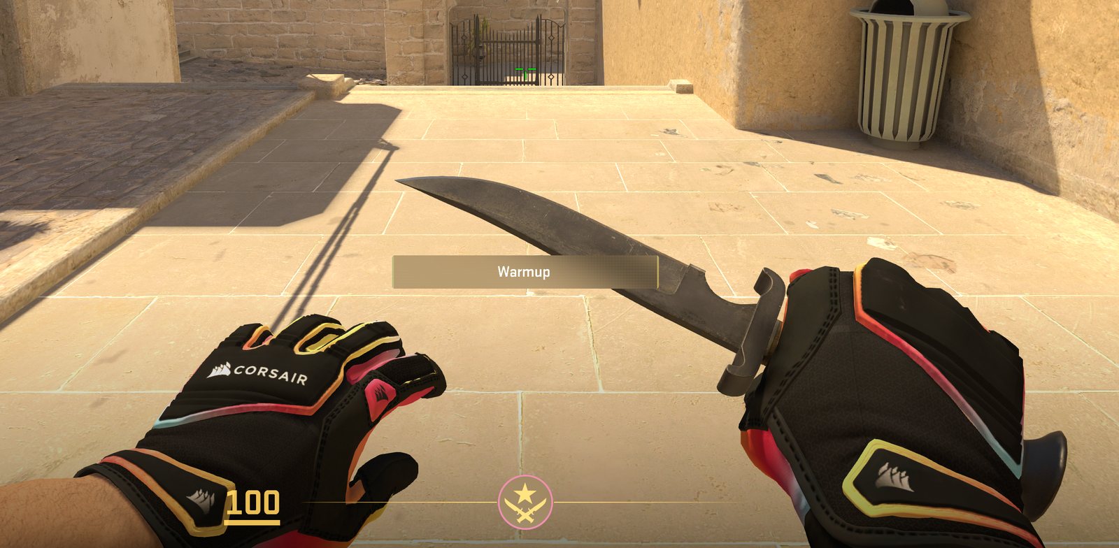 First-person view of Corsair-branded gloves holding a knife, the Corsair wordmark and sail logo visible on the cuff